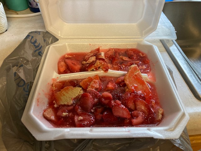 a takeout box filled with strawberry opie that's in shambles. The filling is all liquidy and the crust is crumbly bits but it's still delicious.